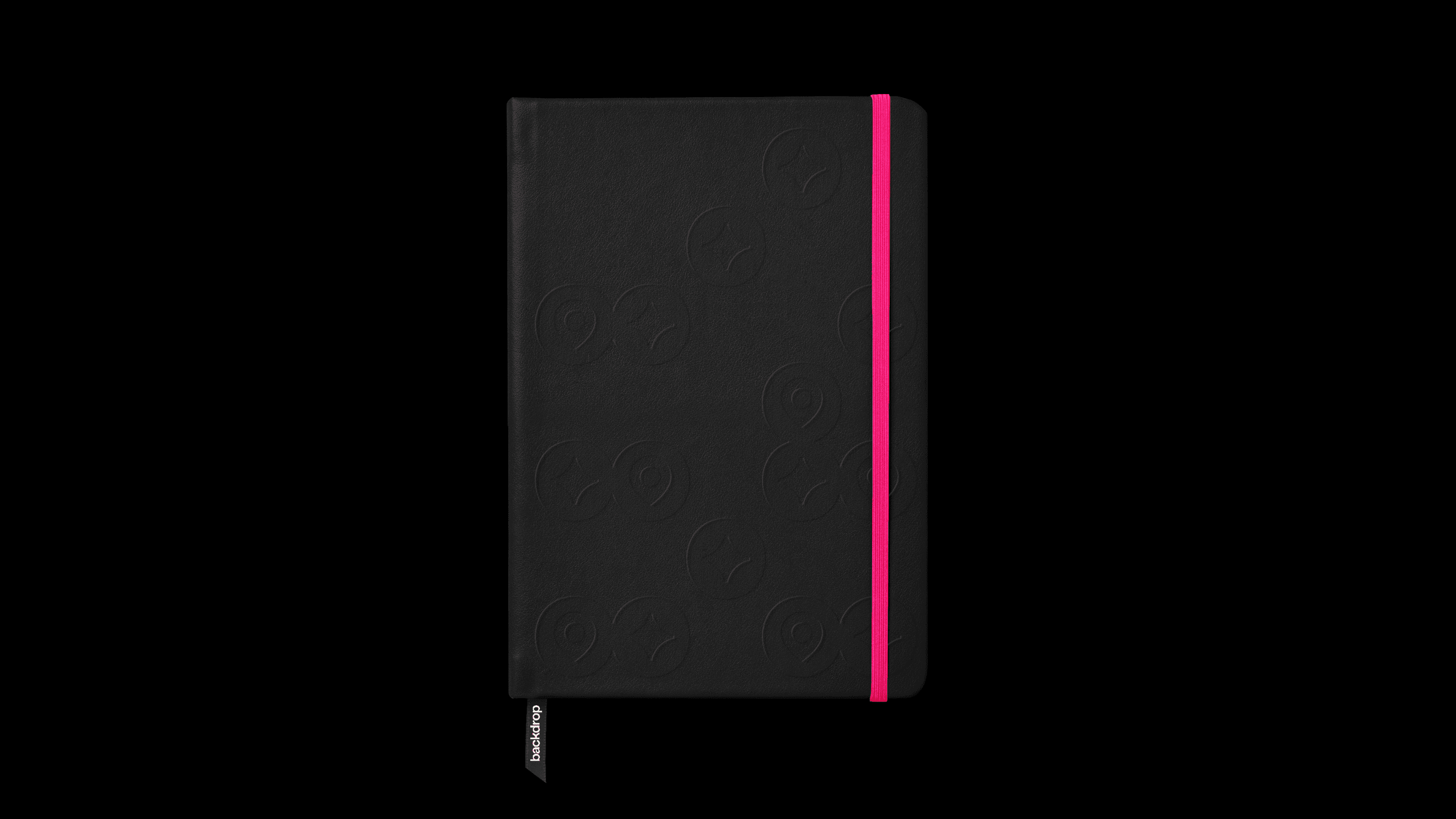 Black Backdrop notebook with embossed symbols and a pink elastic band